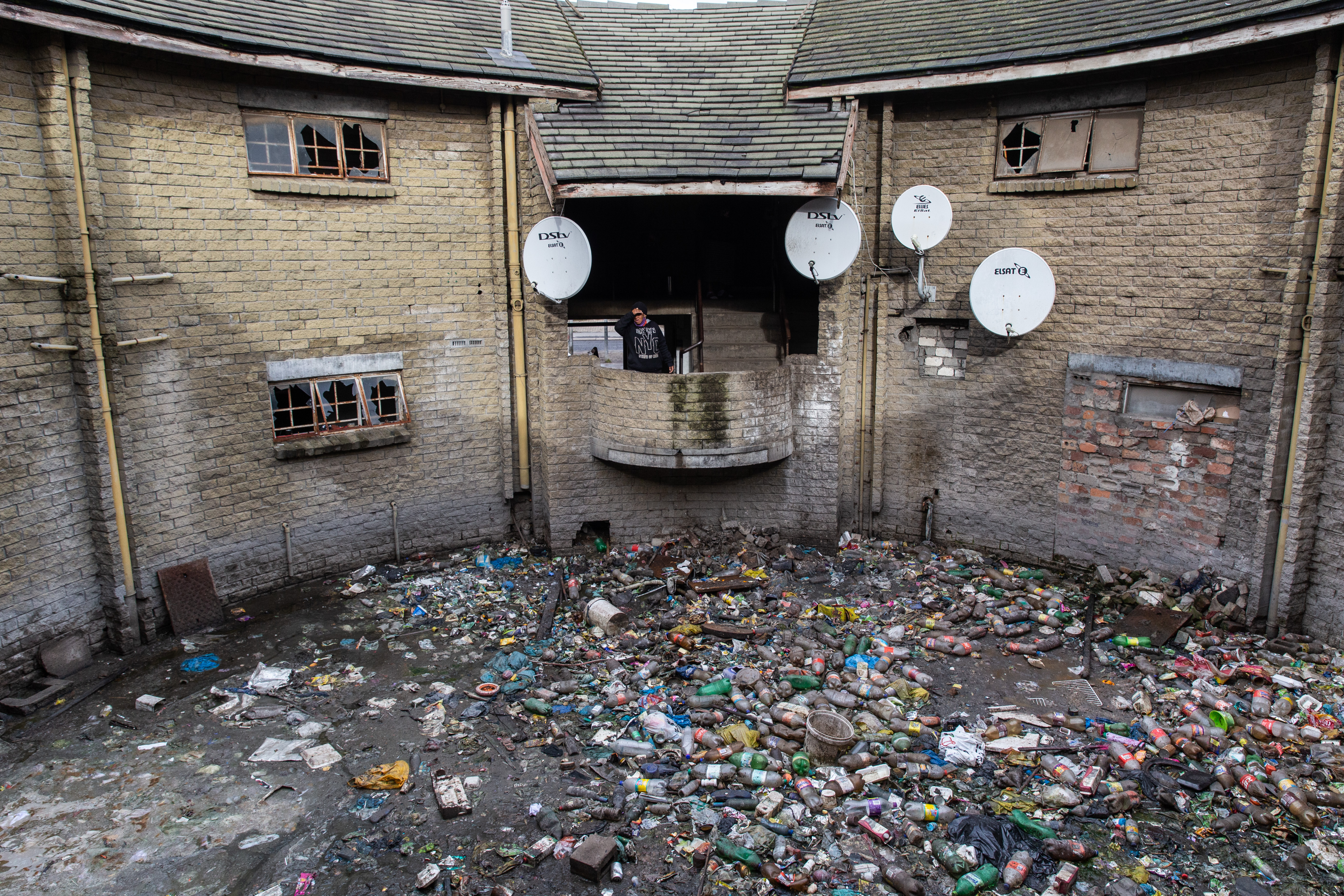Pleas for help from families living in filth and decay in abandoned Cape Flats building