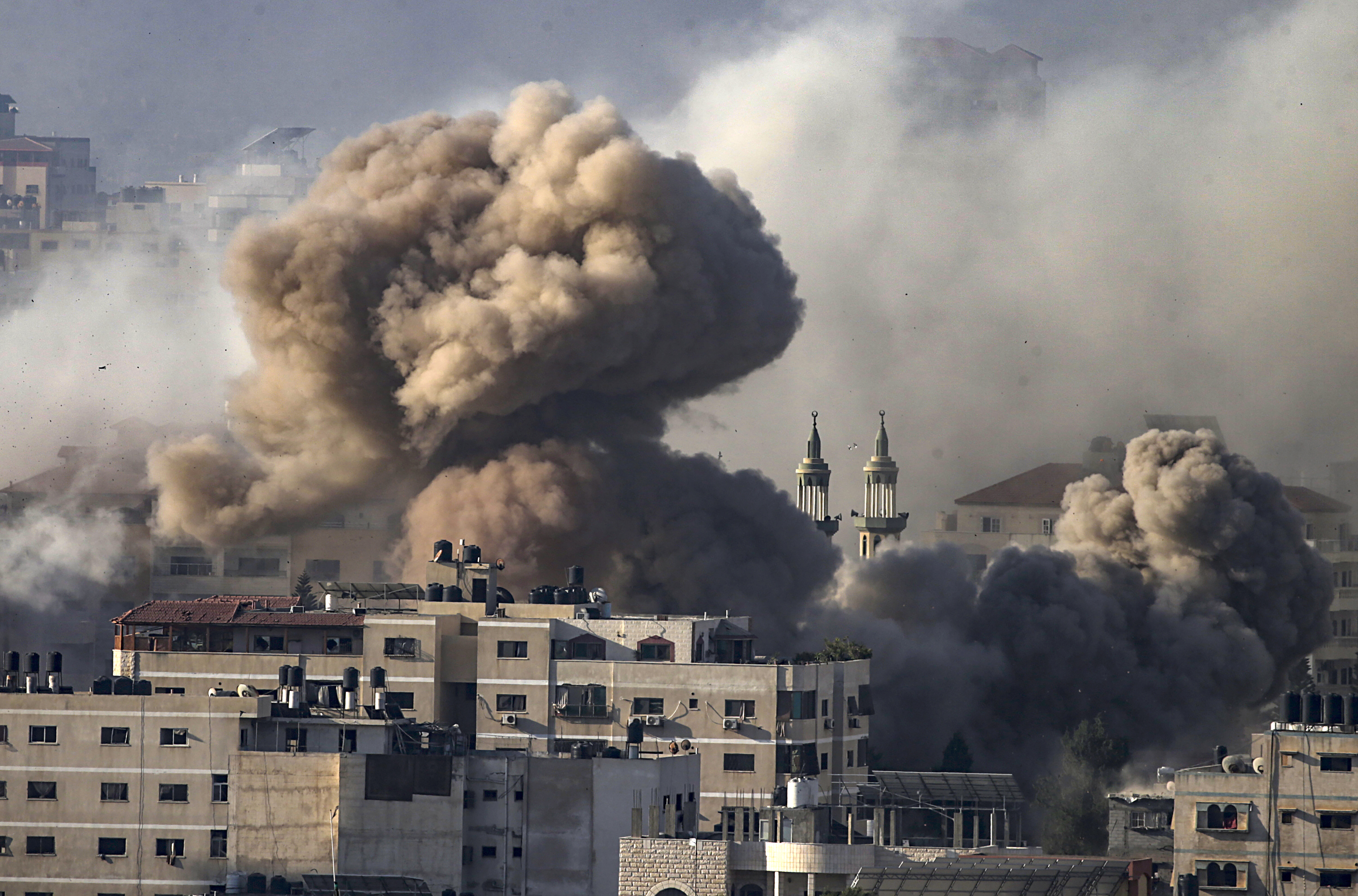 Israel levels Gaza district, hits Orthodox church as invasion looms