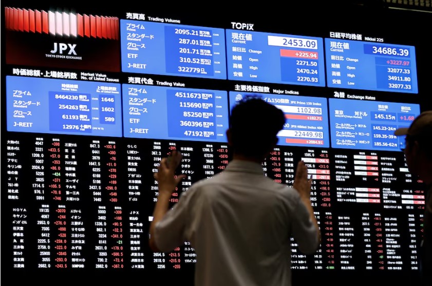 Japanese stocks jump, dollar firms on trade hopes; bitcoin soars