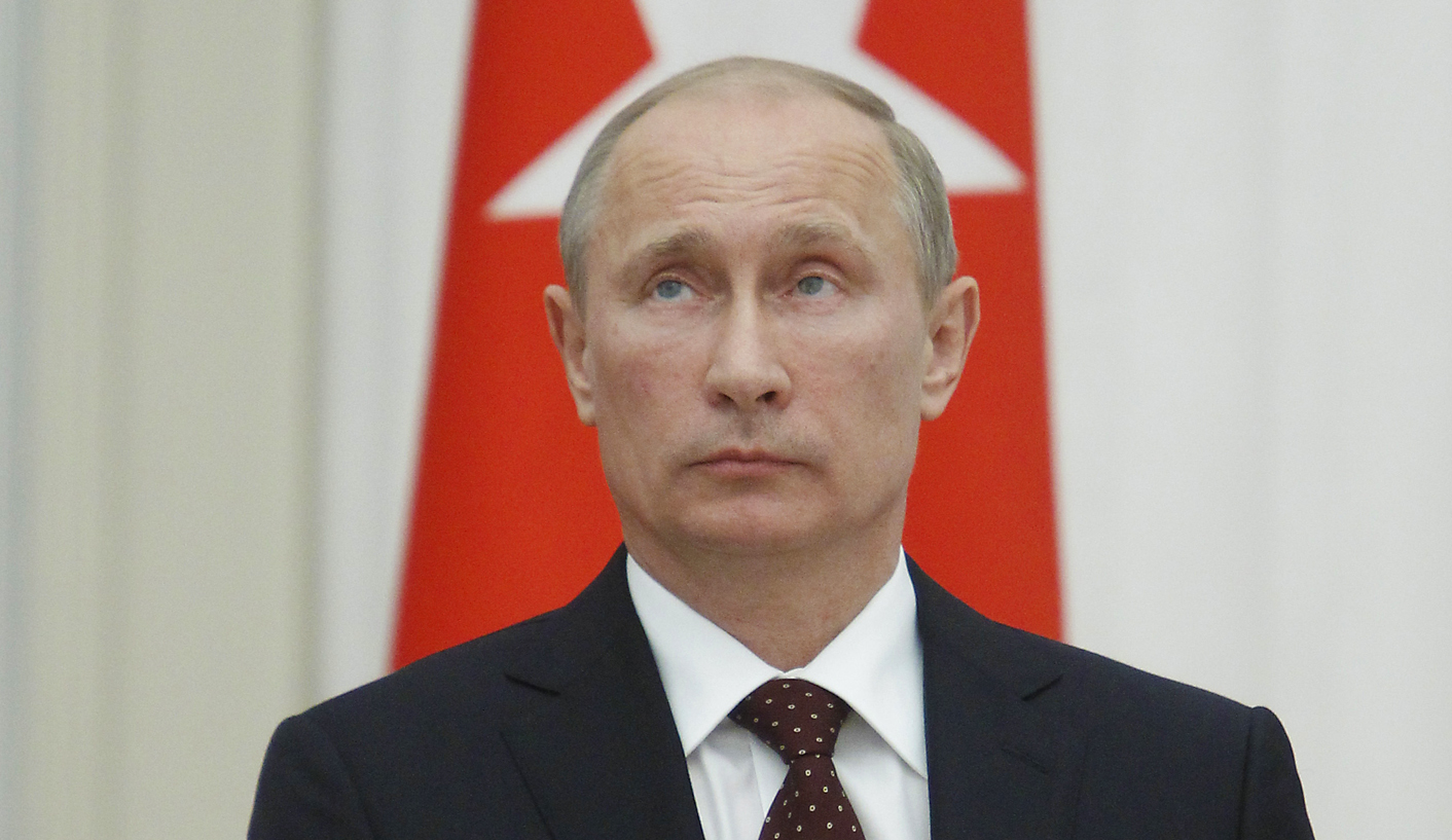 Putin urges Syria talks, signals no shift
