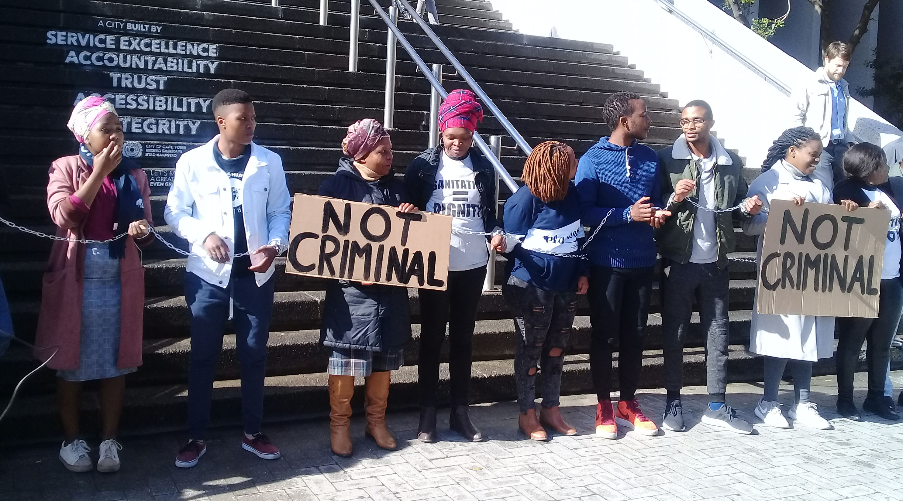 Activists re-enact the 2013 arrest of the SJC10, in protest against Gatherings Act