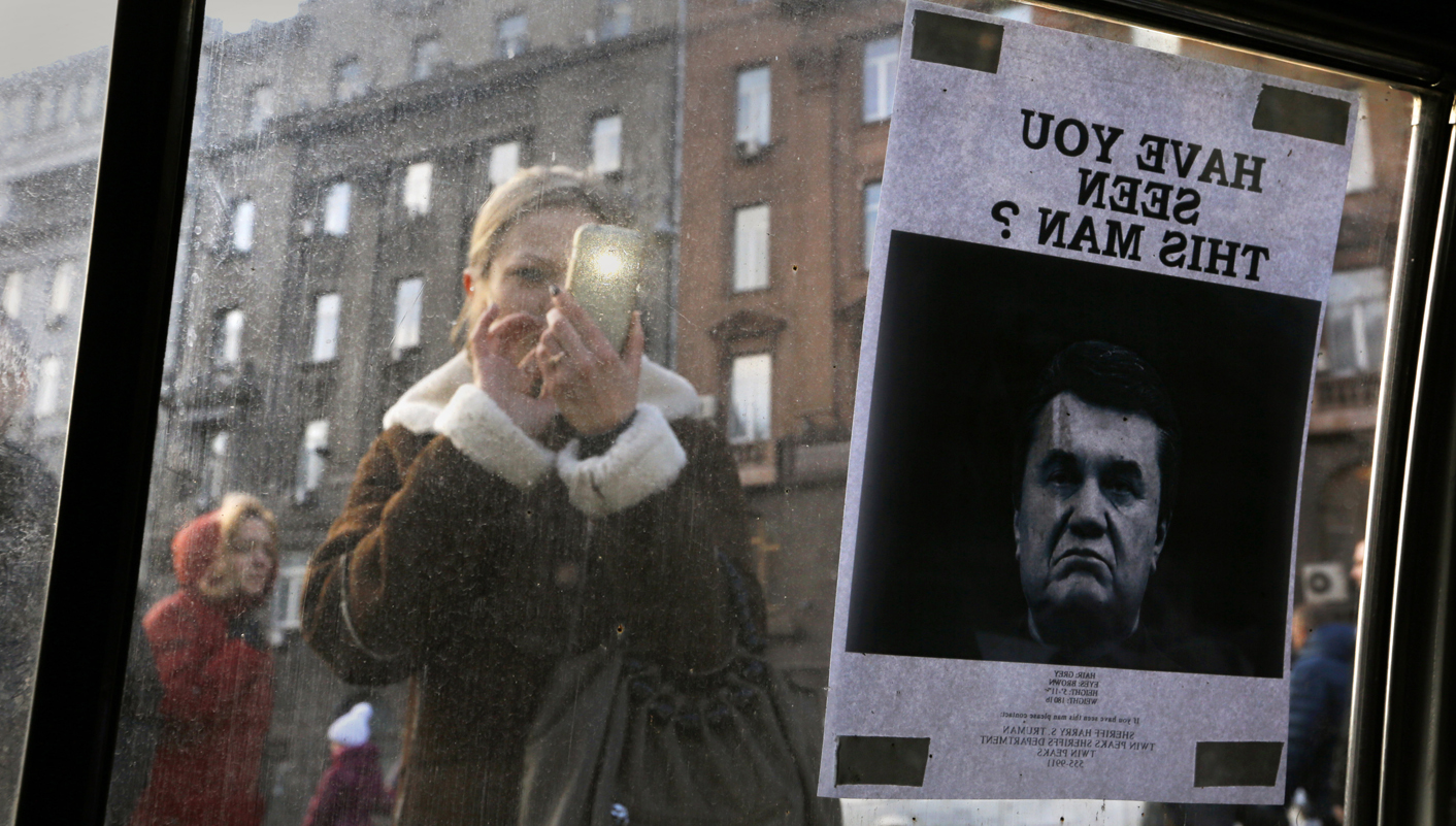 Ukraine wants fugitive president to face Hague court