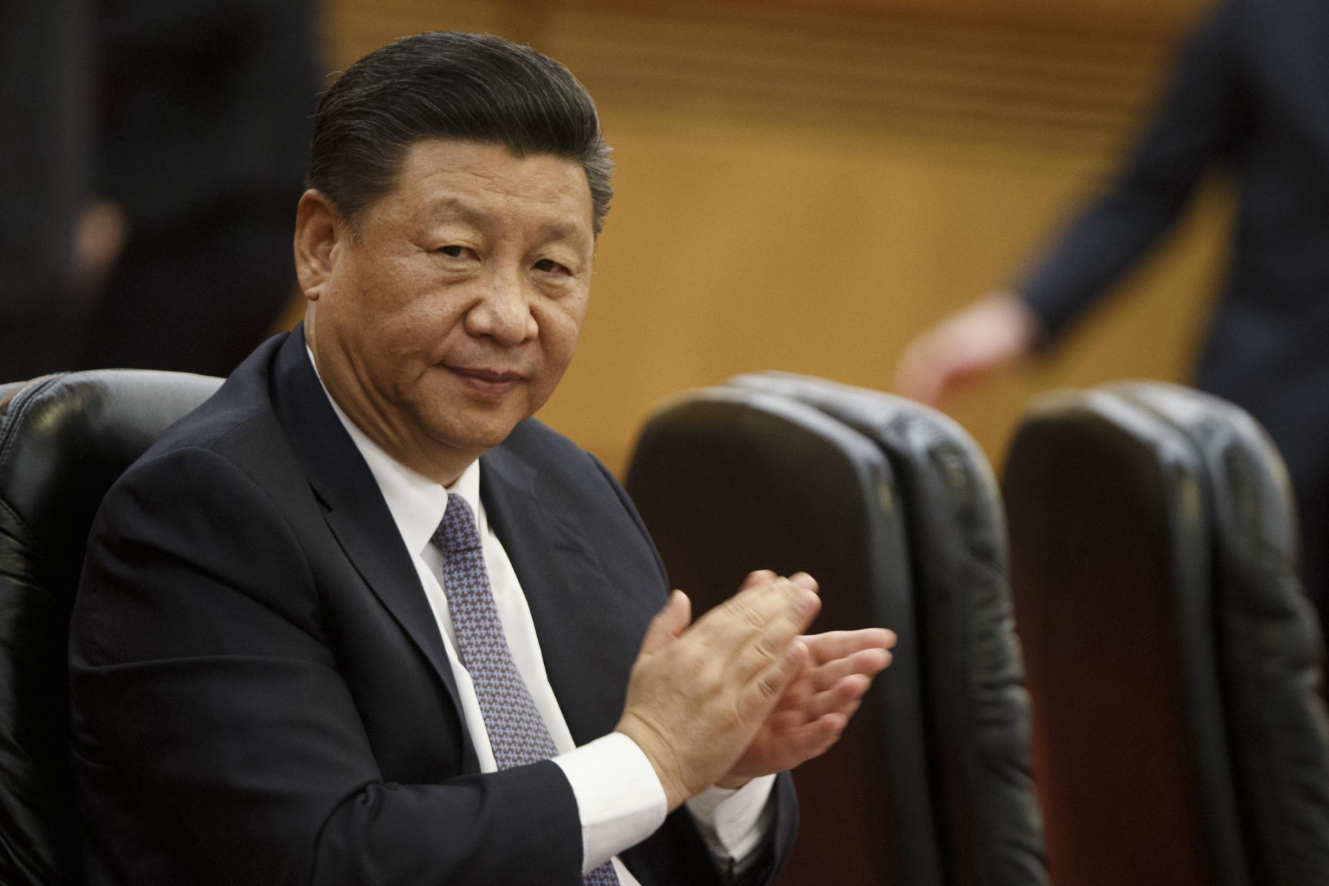 Xi pledges to 'step up' opening China's markets as criticism grows