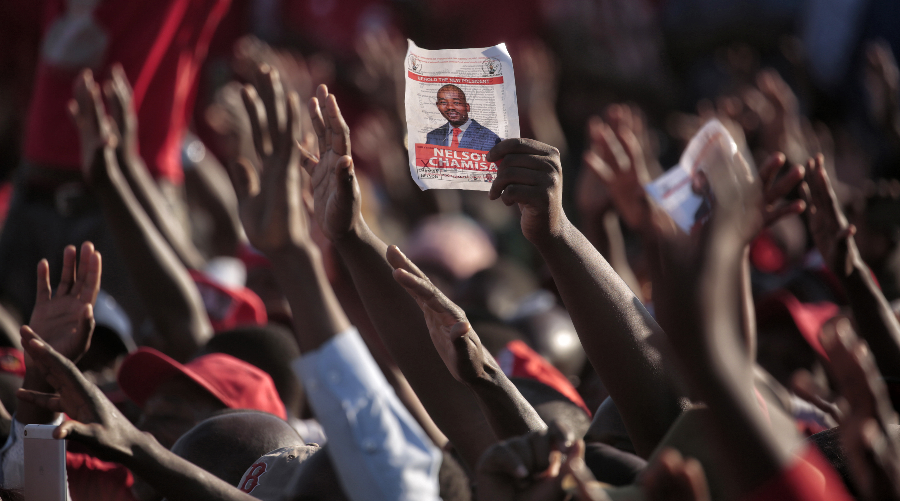 Memories of violence accompany Zimbabweans to historic polls