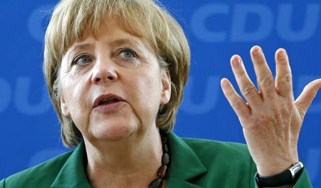 Merkel tries to calm storms over Greece, ECB policy