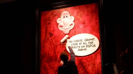 Animal rights protesters 'redecorate' portrait of Britain's King Charles, and more from around the world