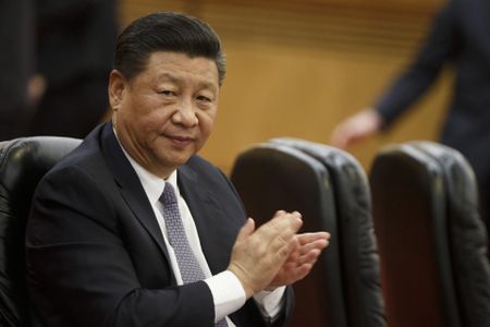 Xi pledges to 'step up' opening China's markets as criticism grows