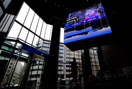 Asian stocks muted, yen calms as BOJ stands pat on rates