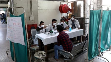 Delhi reserves hospital beds for residents as virus cases surge