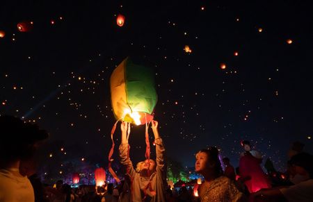 Sky lanterns at the Water Splashing festival in Jinghong, and more from around the world