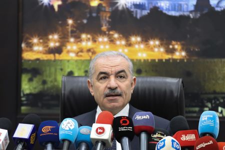 Palestinian Authority government quits; US used AI to find air strike targets - official