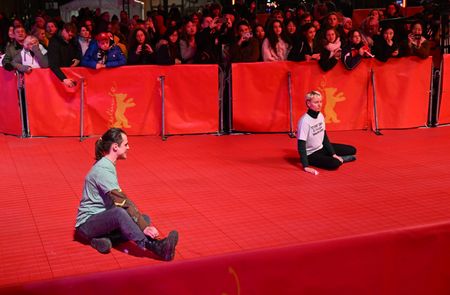 Climate activists glue themselves to Berlinale's red carpet
