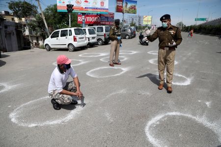 India's coronavirus cases tick up, immense lockdown holds