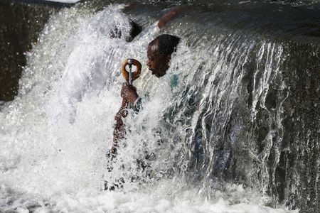 Down in the River to Pray: Good Friday Baptism ceremony at the Klipriver bridge
