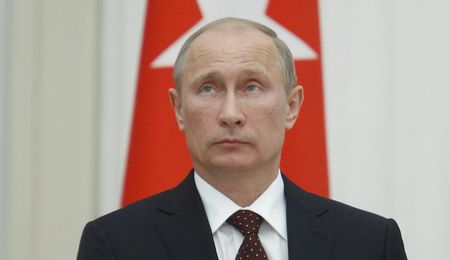 Putin urges Syria talks, signals no shift